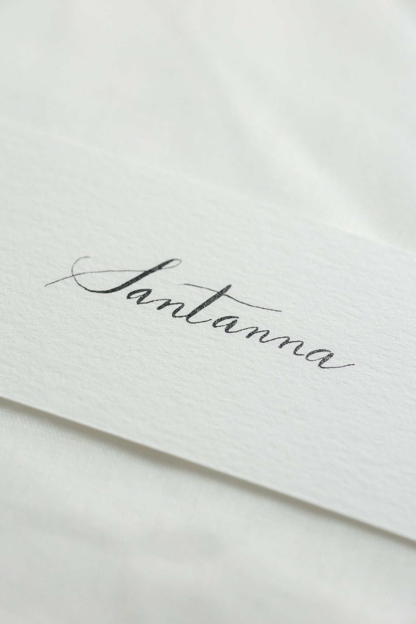 Place cards on natural white paper