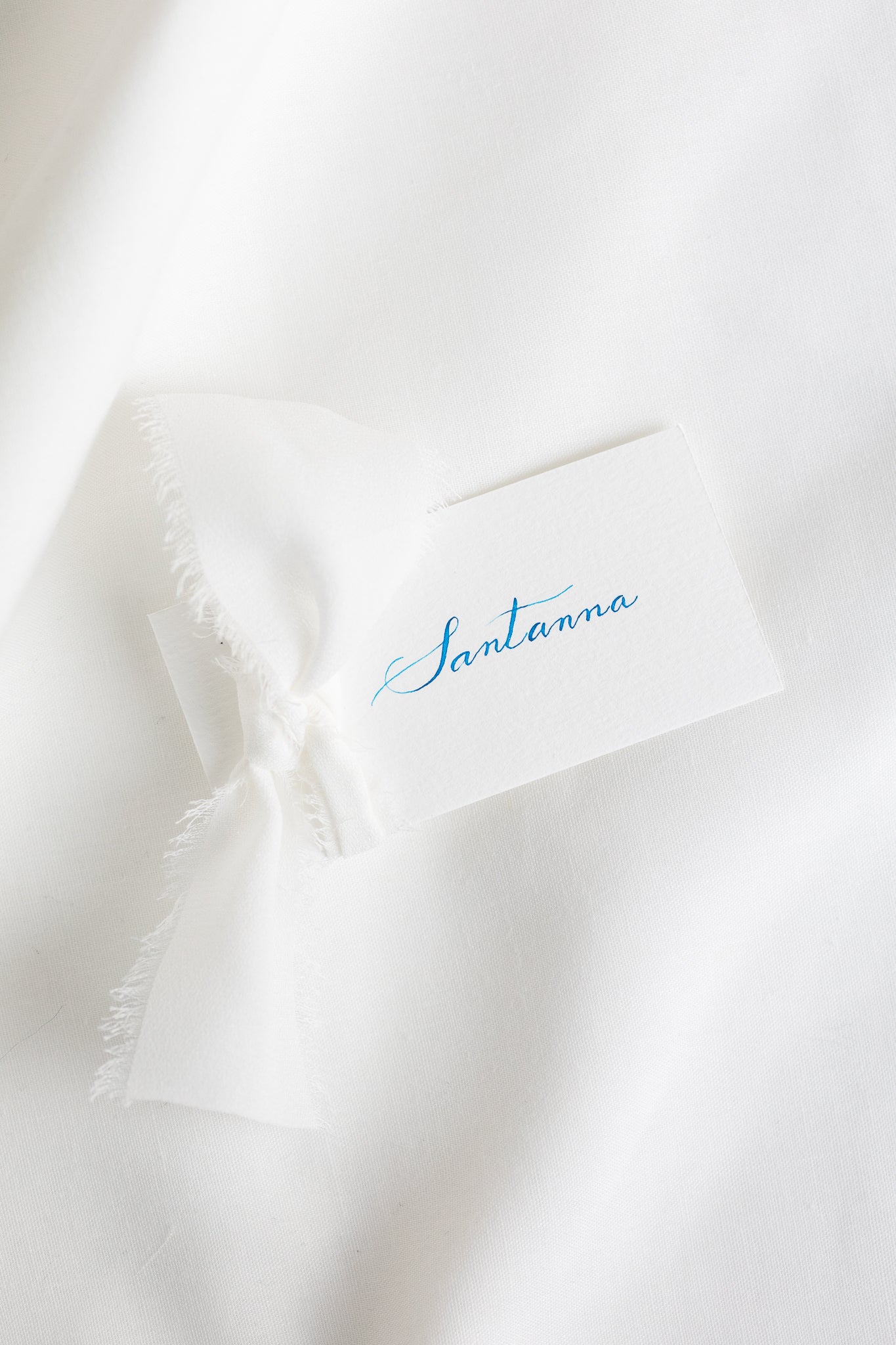 Place cards on natural white paper