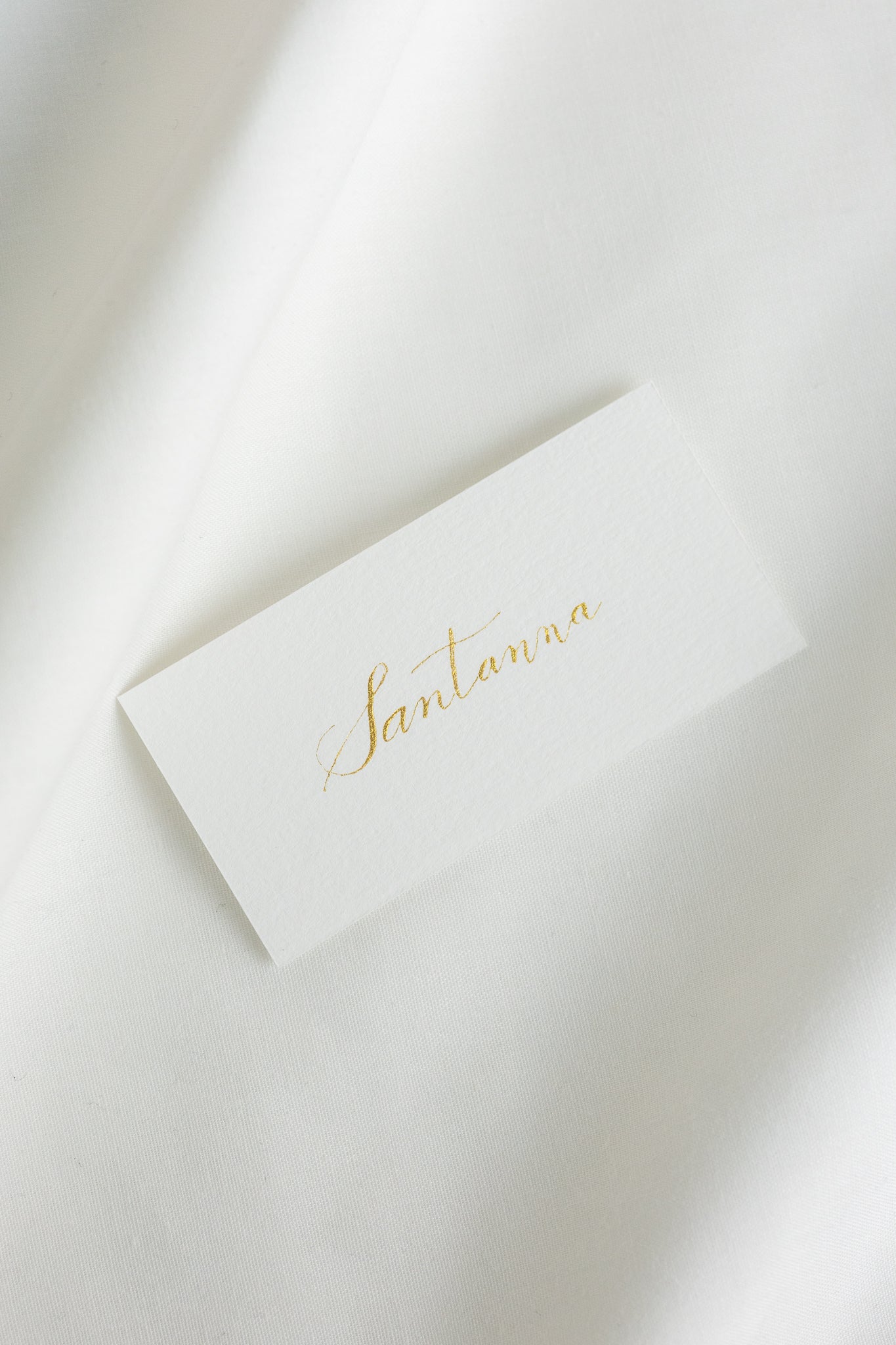 Place cards on natural white paper