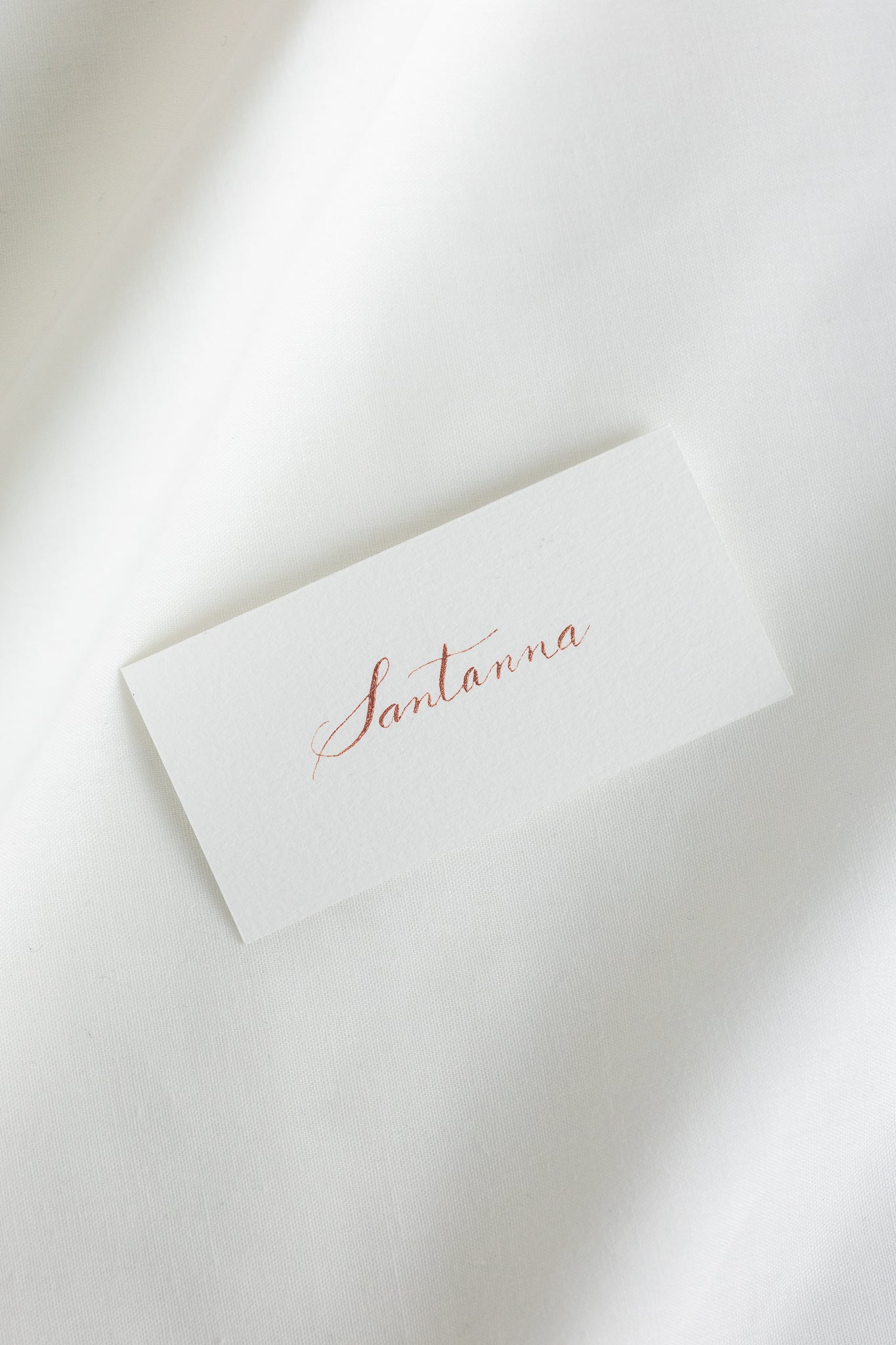 Place cards on natural white paper